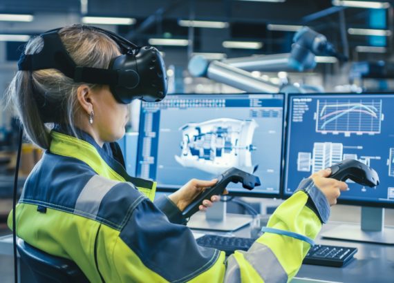 Female worker uses a VR headset and the metaverse to run scenarios.