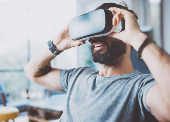 Man uses a VR headset for social interaction.