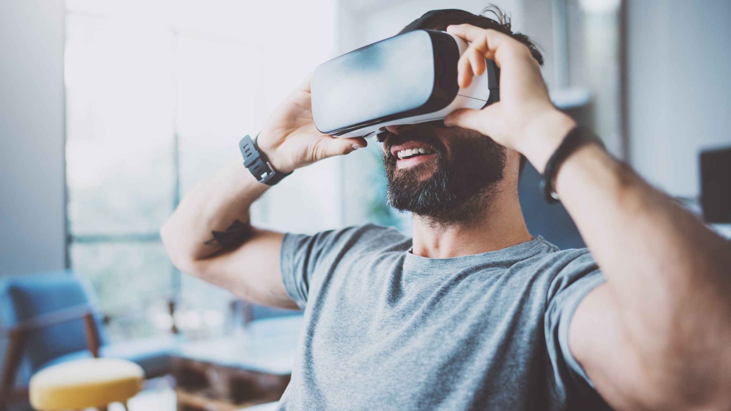 Man uses a VR headset for social interaction.