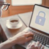 A man logs into the systems at his job. Malicious insiders are often employees with access to information and systems.