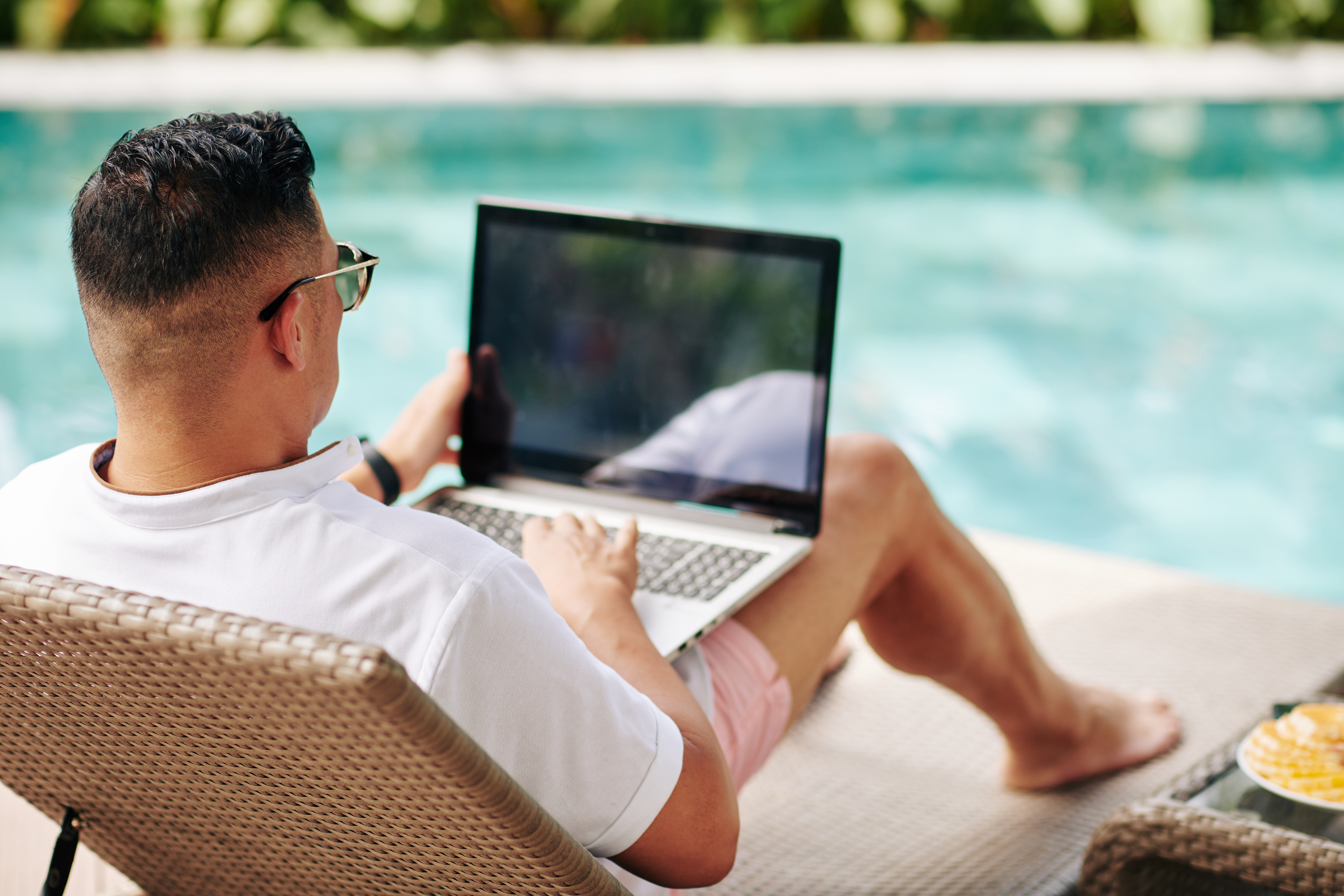 Man using fiber internet at the pool
