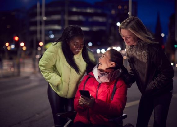 Woman in a wheelchair using accessible technology