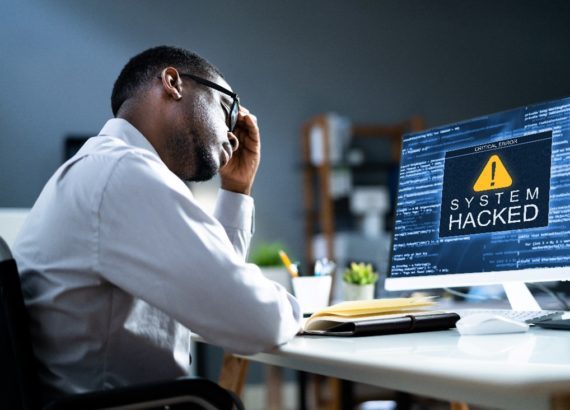 Man learning how to avoid cybersecurity threats