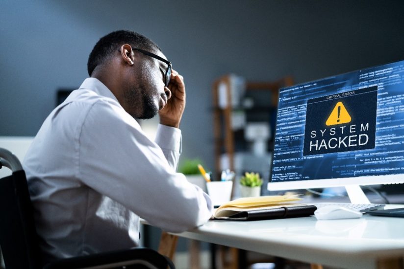 Man learning how to avoid cybersecurity threats
