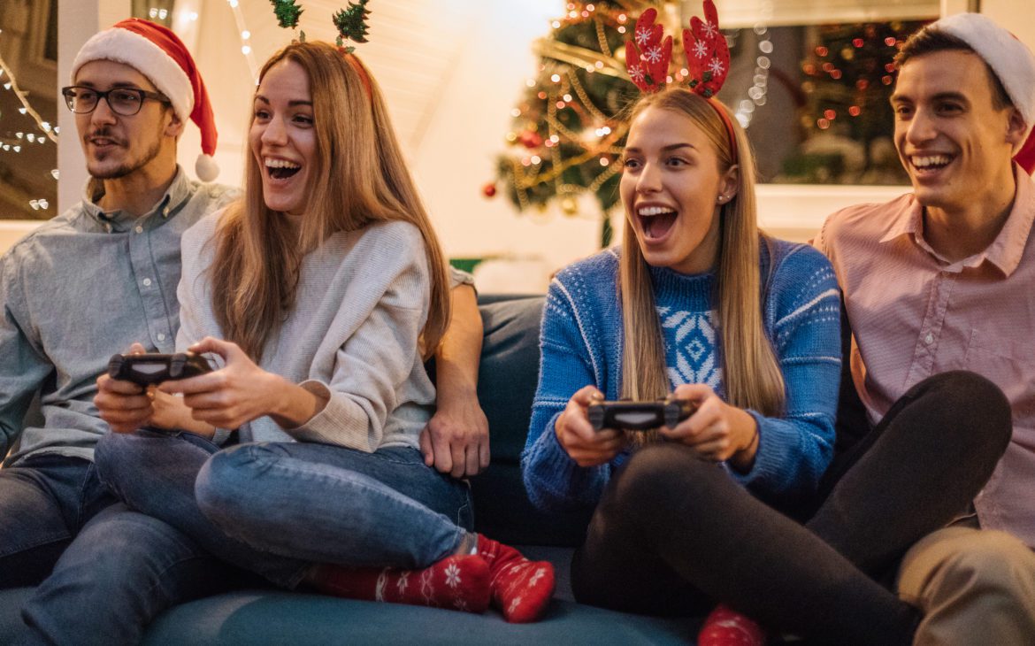 young friends enjoying their cool tech gift, a gaming console