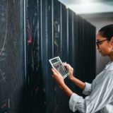 woman demonstrating "what is encryption" in real life in a data center
