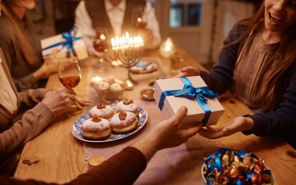 family sharing cool tech gifts over a meal