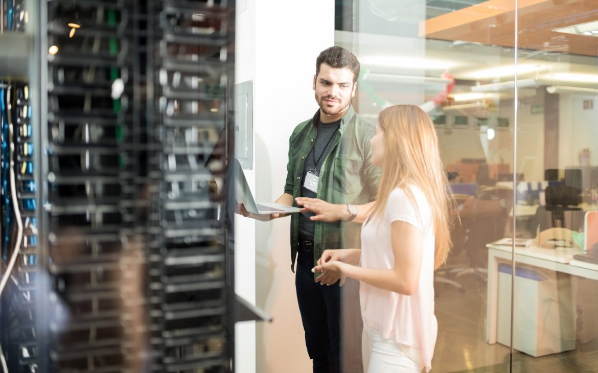 Man and woman in data center providing high gig speed
