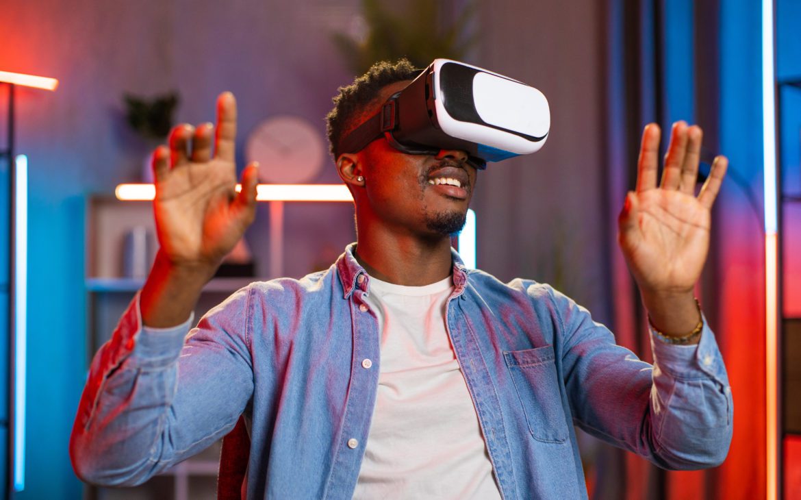 Man smiling while using VR accessories