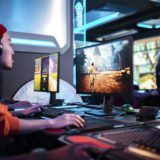A young man dives into internet for gaming on multiple screens!