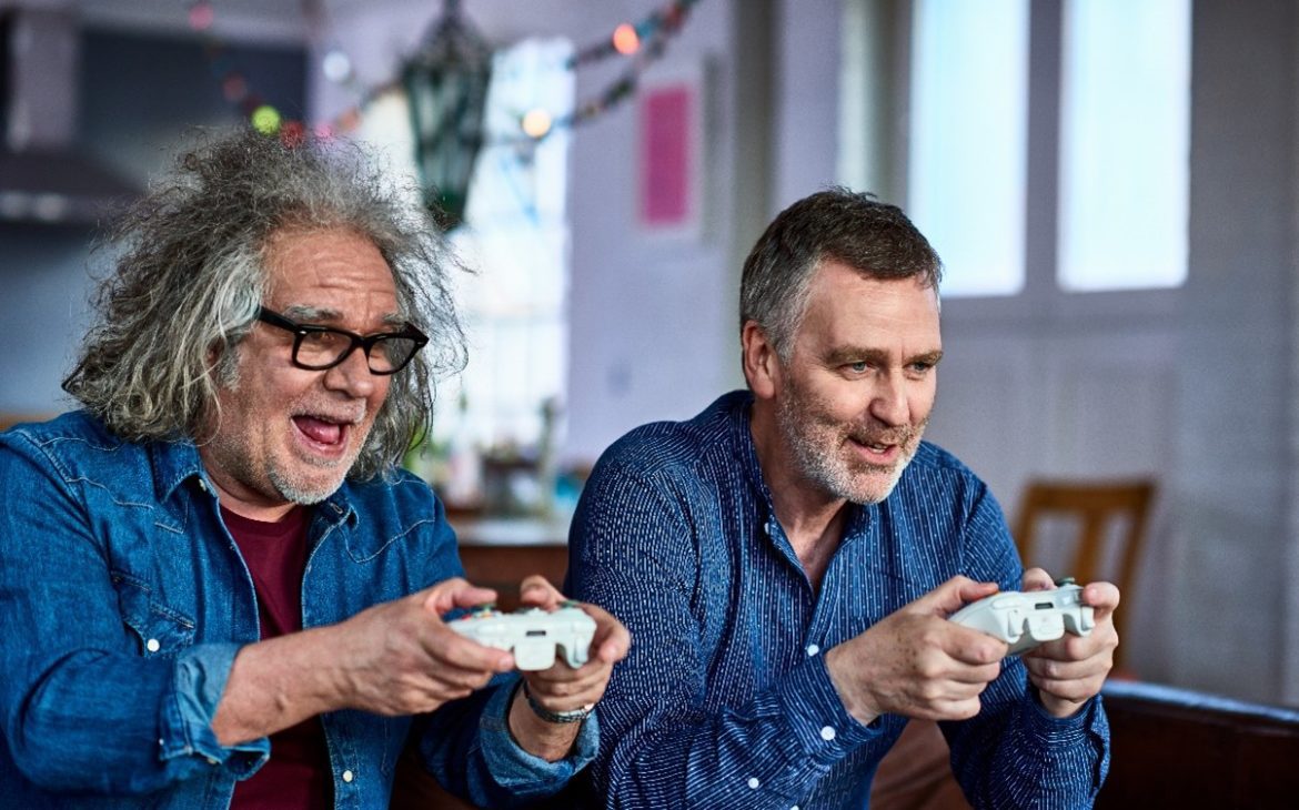 Senior gamers playing PS5