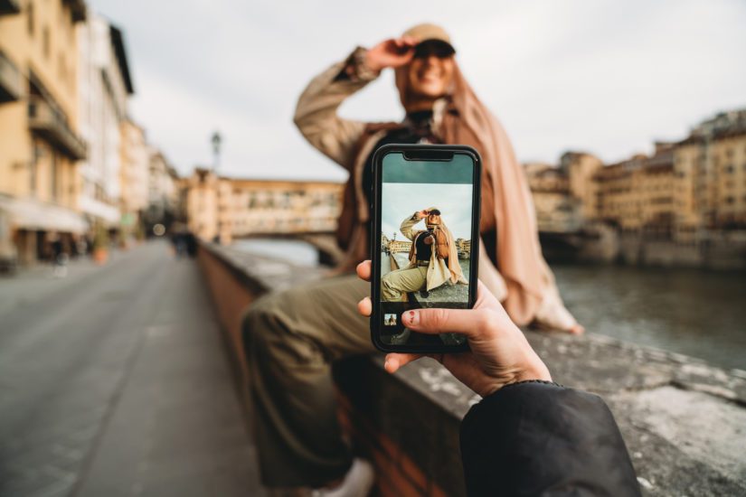 A young woman enjoys having her picture taken, but knows to practice good social media privacy! 