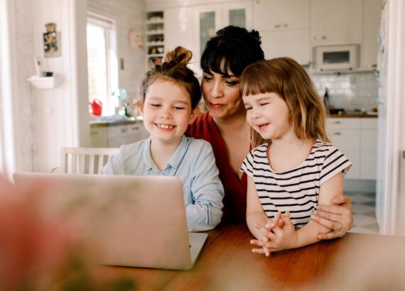 Mom using parental controls with daughters
