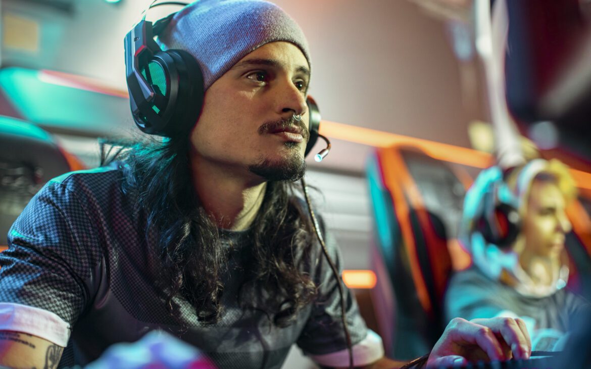 Young man gaming with headset 
