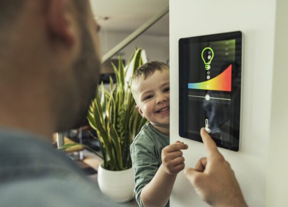 Little boy playing with thermostat