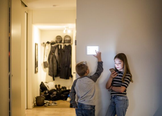 Kids controlling smart home on the wall