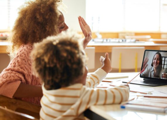 Mother and son using online learning platforms