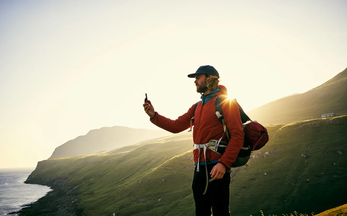 A man searches for WiFi while travelling