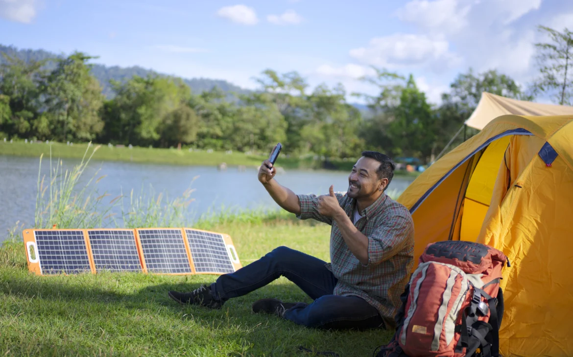 A man uses a solar battery charger