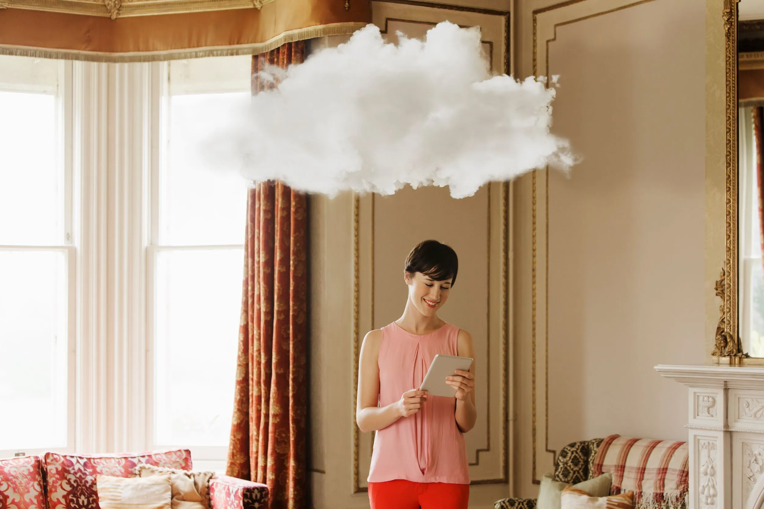 Lady with a cloud over head depicting cloud storage