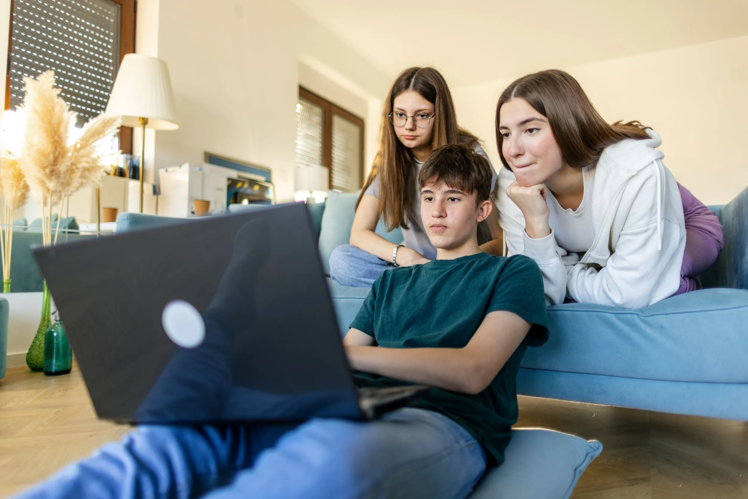 Kids looking at laptop