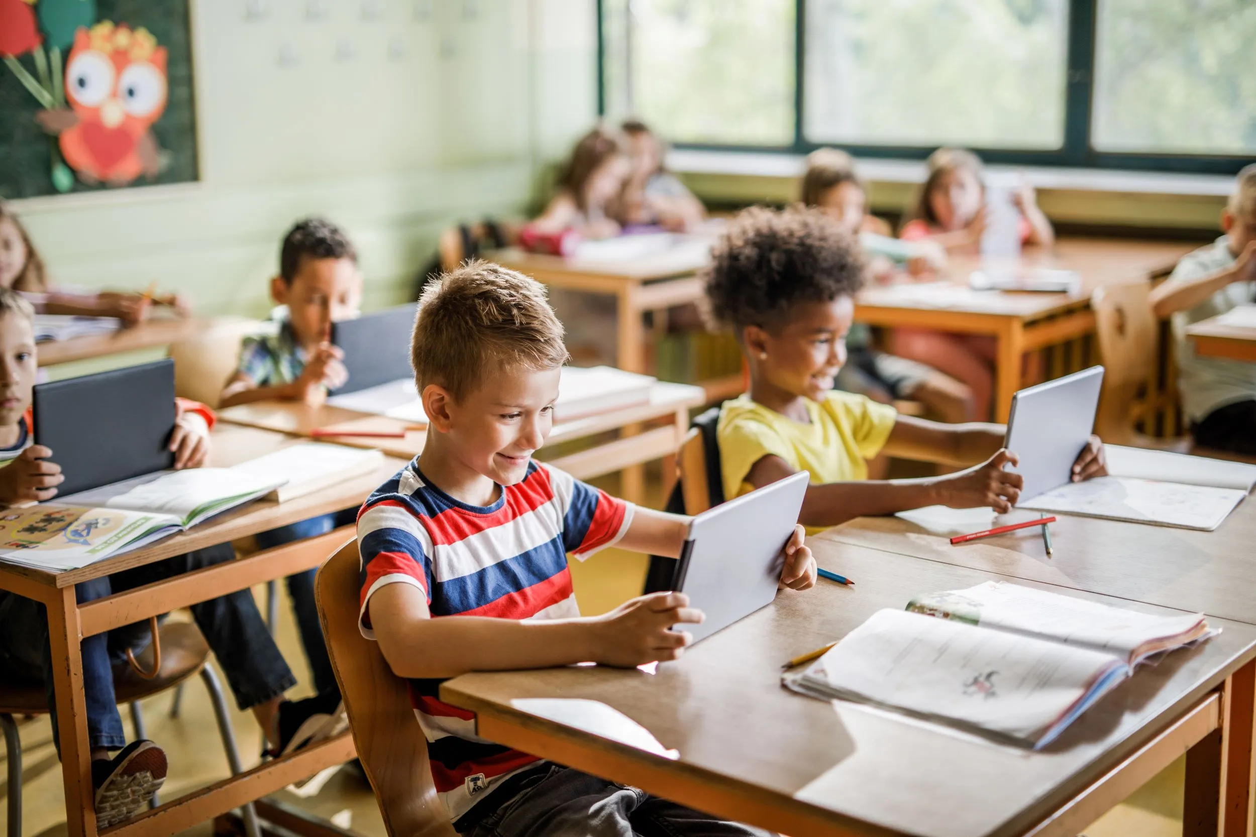 Kids using tablets in classroom