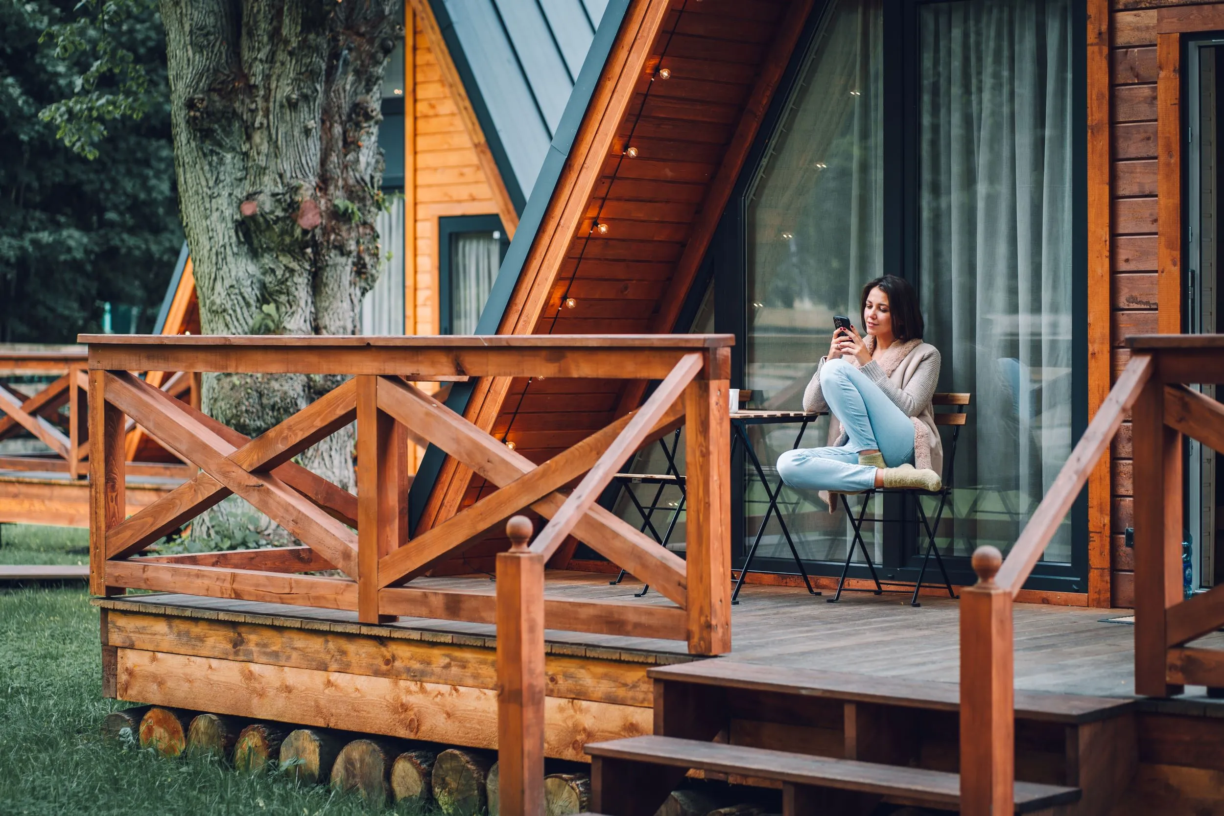 Women using wifi at an A Frame cabin