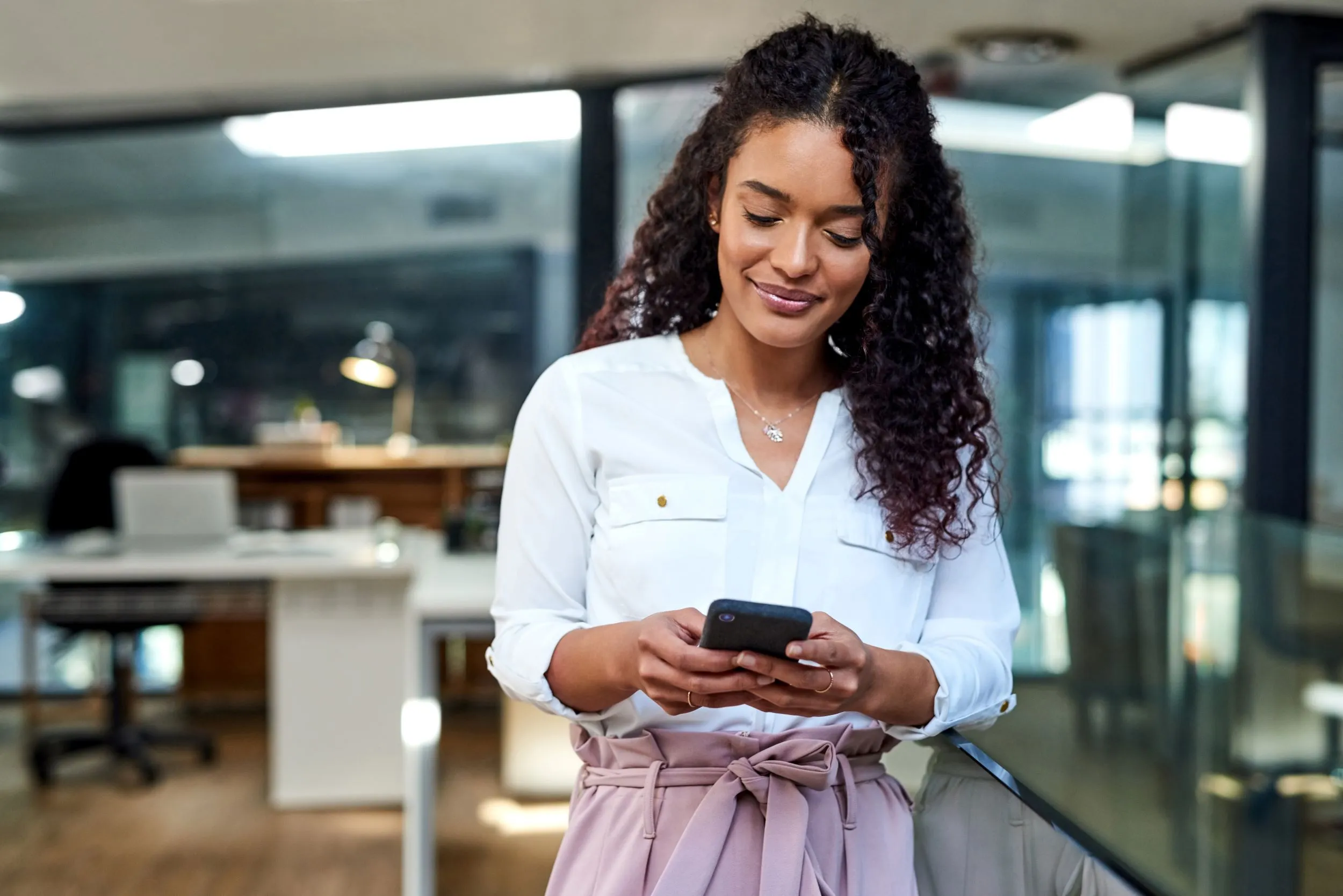 Women checking sale notifications on mobile device