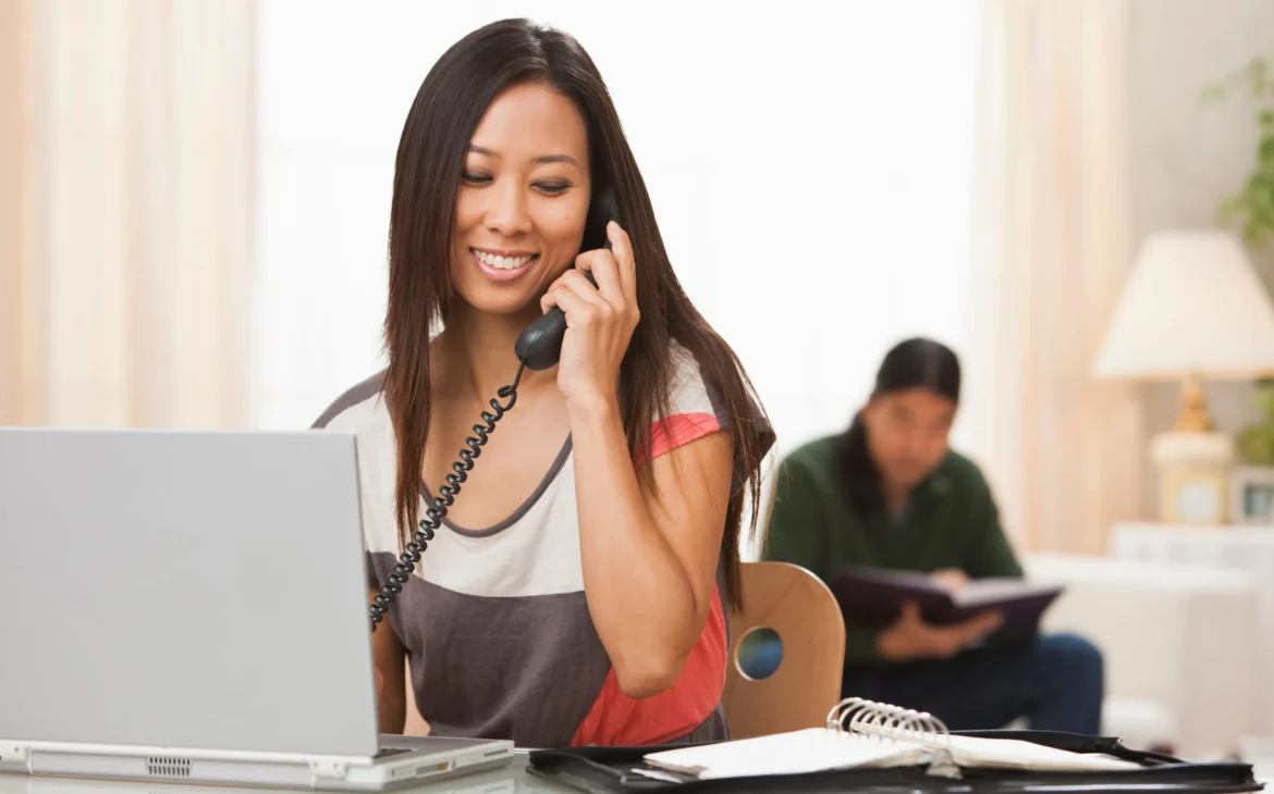 Women using a telephone over fiber internet