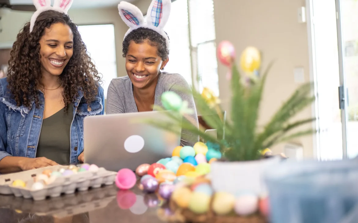 Painting Easter eggs while watching a how to video on YouTube
