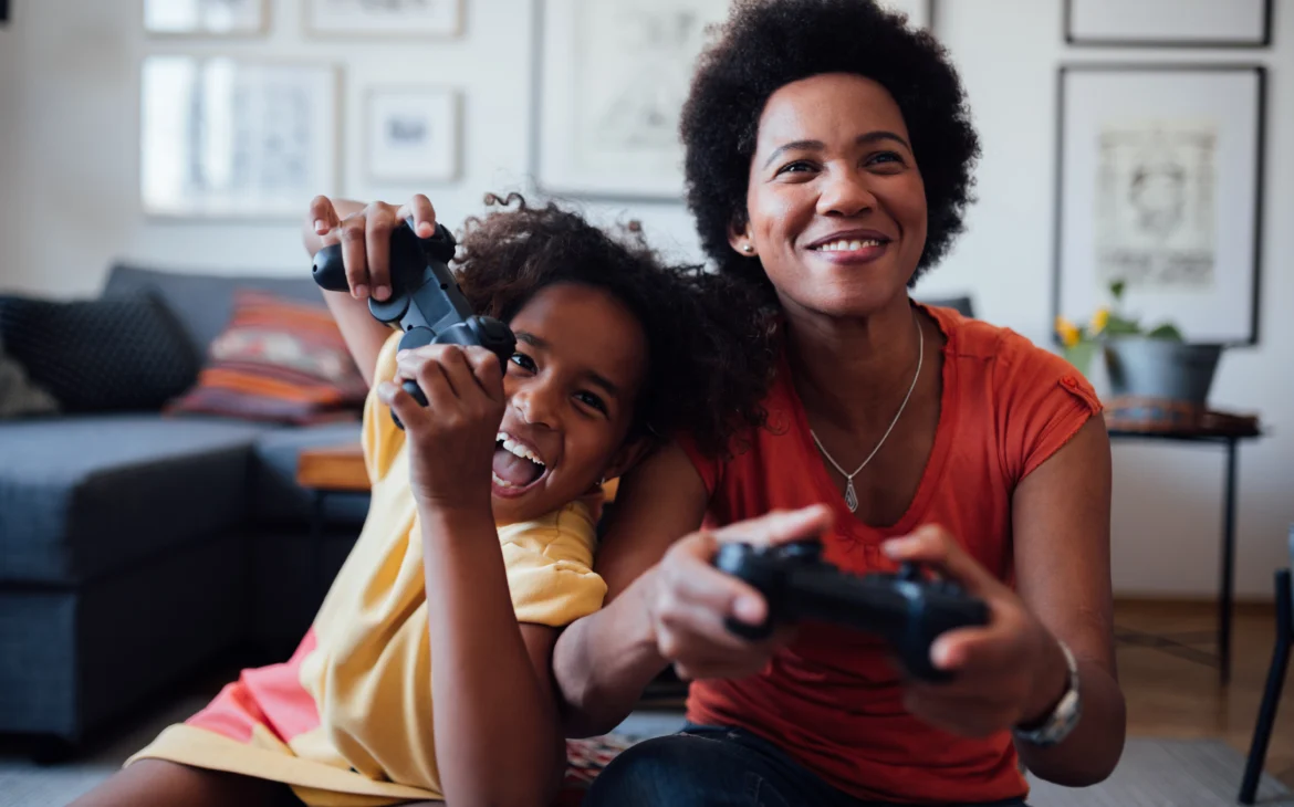 Mom and daughter playing video games