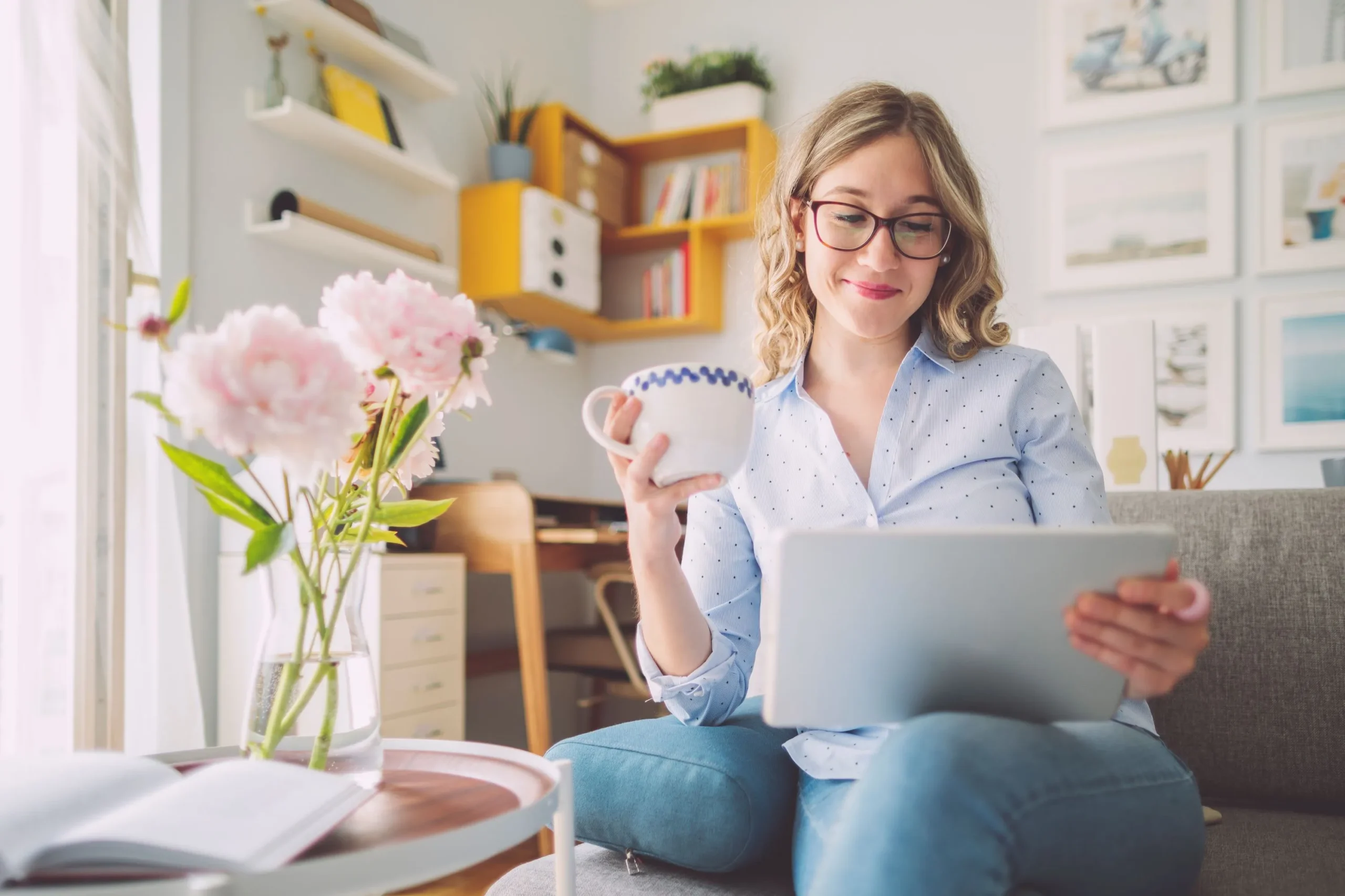 Women drinking coffee while using laptop