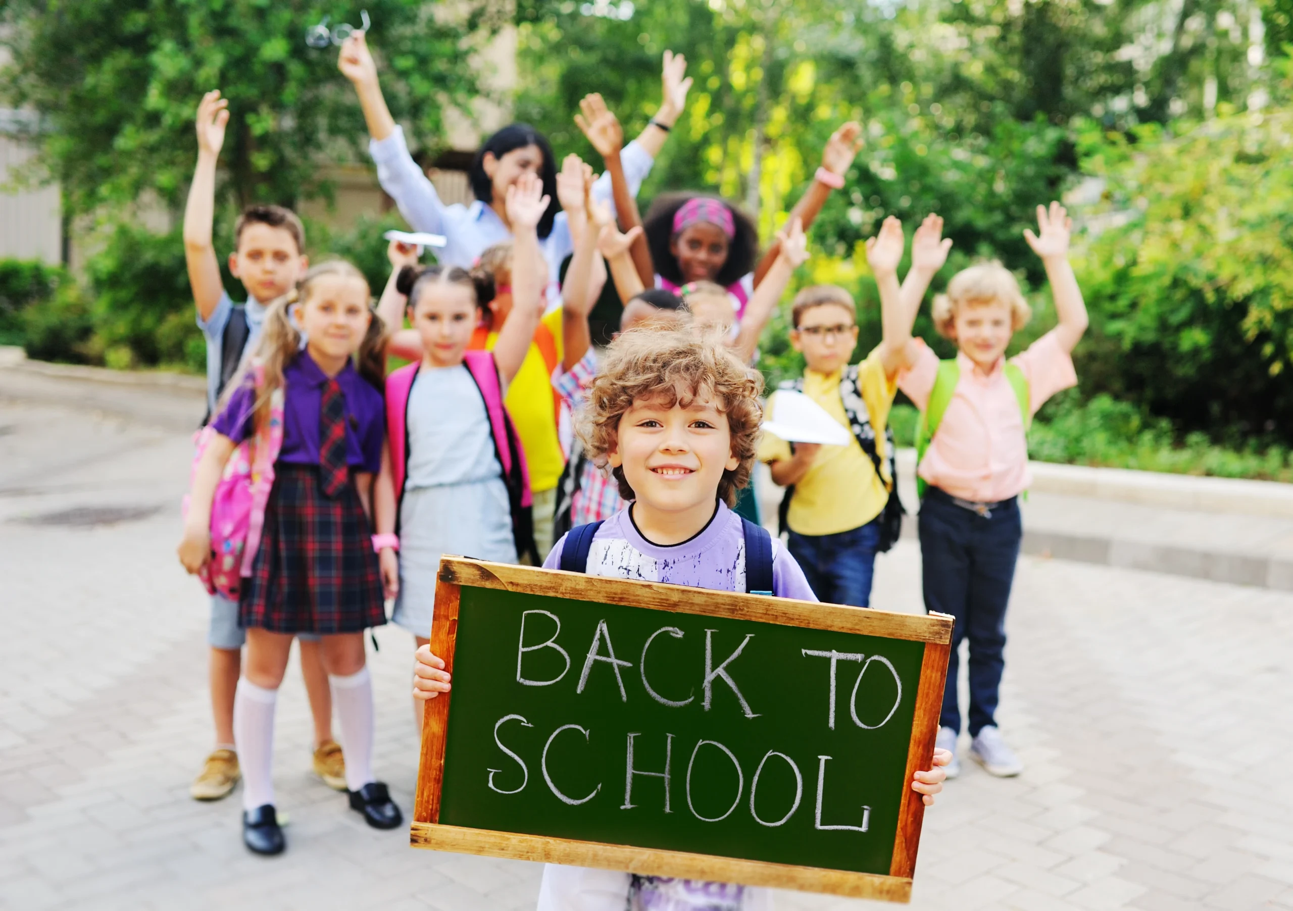 Group of kids with back to school sign