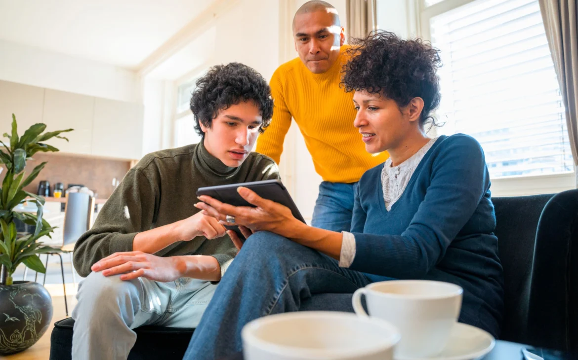family-looking-at-device